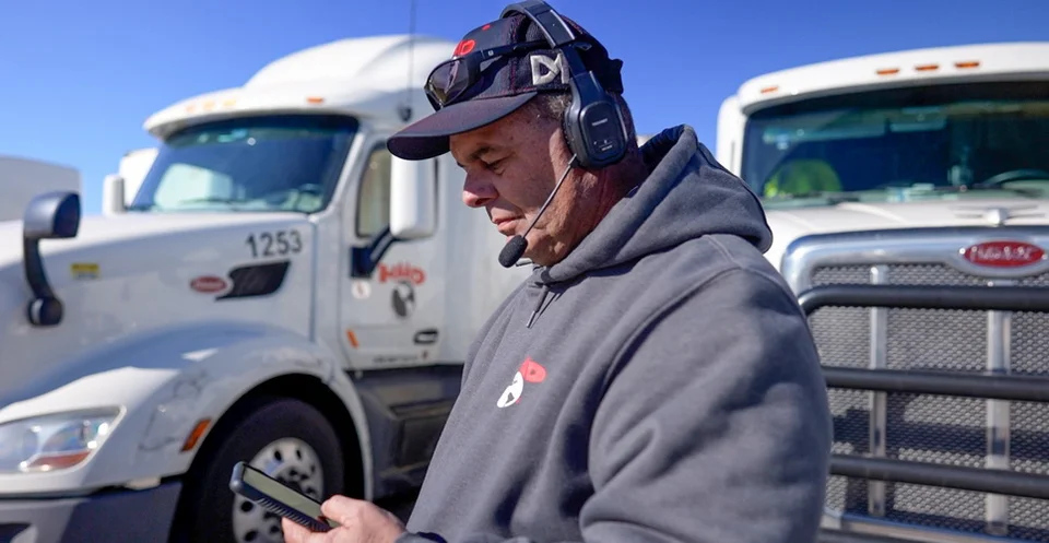 Truck Driver Use Phone With a Headset
