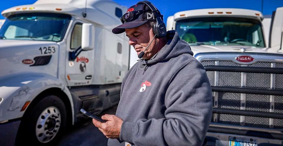 Truck Driver in Front of Semi-truck