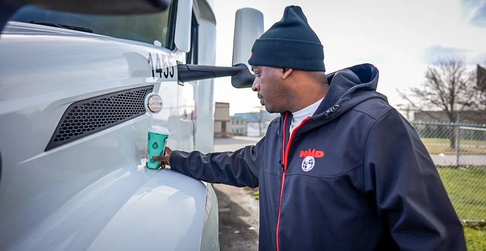 Trucker with Cup of Hot Coffee